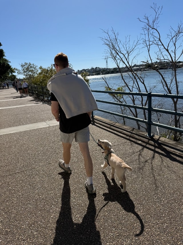 Matt Sale walking Charlie along the river